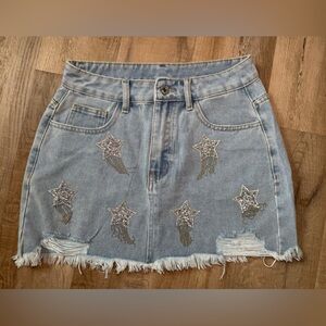 Mini skirt with sparkly stars and silver tassels
